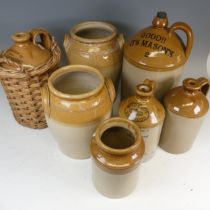 A antique quantity of stoneware Flagons and Storage Jars, to comprise one in wicker surround, Wild