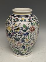 A large 20thC Poole Pottery Vase, decorated by N Blackmore in a Persian style, with entangled