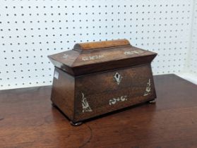 An antique Regency style rosewood and mother of pearl sarcophagus tea Caddy, fitted interior and