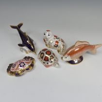 A Royal Crown Derby Carp Paperweight, without stopper, together with a Dolphin, Seal and Crab of