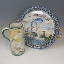 A Continental majolica two-handled Charger/Tray, with a similar jug, both decorated in the style