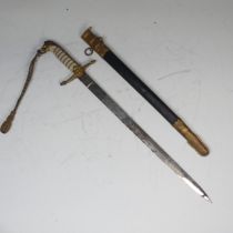 A reproduction George VI British naval inspired officers Dirk and scabbard, lion head pommel, the