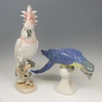 A large Royal Dux porcelain figure of a Parrot, with blue feathers, raised on ball finial, pink
