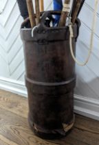 A 19th century leather artillery Cordite (shell carrier), cylindrical body with a raised band and