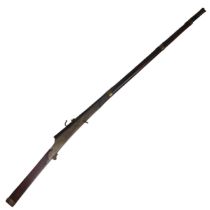 A 19th century matchlock Musket, the steel muzzle and barrel with brass straps, barrel stamped