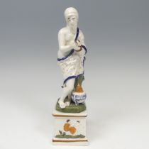 An early 19thC pearlware figure of Asclepius, possibly Ralph Wood, decorated in typical pratt ware