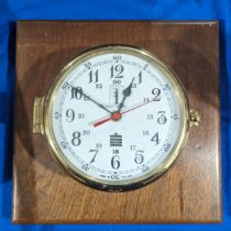 A brass mounted Sewills Radio Master port-hole Clock, Liverpool, battery operated, W 26.5 cm x H
