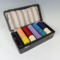 A leather cased set of gaming chips by Fortnum and Mason, W 26 cm x H 8.5 cm x D 13 cm.