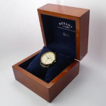 A cased Rotary Elite 18ct gold quartz Wristwatch, 33mm diameter, with guarantee booklet, running, as