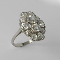 An Art Deco diamond Cluster Ring, the old cut stones millegrain set in platinum on a plain shank,
