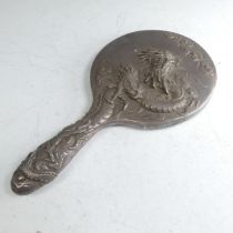 An early 20thC Oriental silver Hand Mirror, with scrolling dragon decoration, character mark on fra