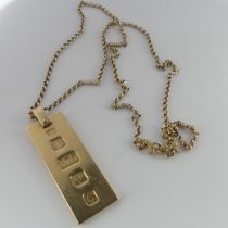 A 9ct yellow gold Ingot Pendant, hallmarked London, 1977, on 9ct gold chain, the chain 62.5cm