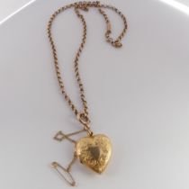 An Edwardian 15ct gold heart shaped Pendant Locket, hallmarked Chester, 1908, the front with foliate