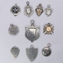 A collection of ten silver Fobs, early-to-mid 20thC, six with presentation inscriptions and four