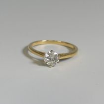 A diamond solitaire Ring, the brilliant cut stone approx. o.62ct, six claw set in 18ct yellow