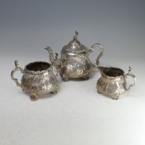 A Victorian silver three piece Tea Set, by Robert Harper, hallmarked London, 1879, of circular