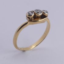 A small three stone diamond Ring, millegrain set on the cross in 18ct yellow gold and platinum, Size