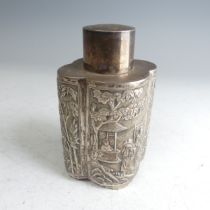 A Chinese export silver Tea Caddy, of lobed oval form with pull off circular cover, one side with