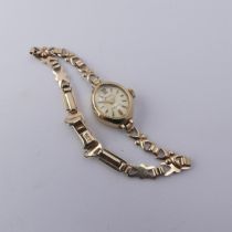 A 9ct gold lady's Wristwatch, on 9ct bracelet strap, gross total weight 9.1g.