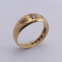An 18ct yellow gold Band, gypsy set with three graduated diamond points, Size M, 4g.