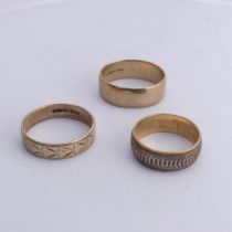 A 9ct two colour gold Band, with geometric decoration, 6.9mm wide, Size P, together with a 9ct
