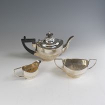 A matched late Victorian silver three piece bachelor's Tea Set, the teapot by Williams Ltd.,