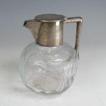 A George V silver mounted Claret Jug, by John Grinsell & Sons, hallmarked Birmingham 1910, of