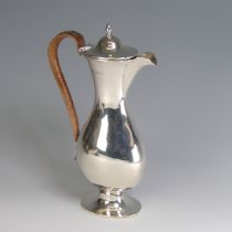 An Edwardian silver Hot Water Pot, by Brewis & Co., hallmarked London, 1901, of baluster form with