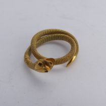 A 9ct gold mesh Ring, forming a coiled snake, with ruby glass eyes, 3.6g.