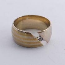 A 14ct gold Band, the abstract split front with single white paste, Size N, 6.8g.