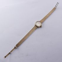 A 9ct yellow gold lady's Tissot Wristwatch, 12mm diameter, on an integral 9ct gold mesh bracelet