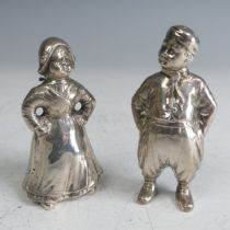 Two Dutch silver novelty Figural Cruets, the lady in full dress with hinged head and pierced bonnet,