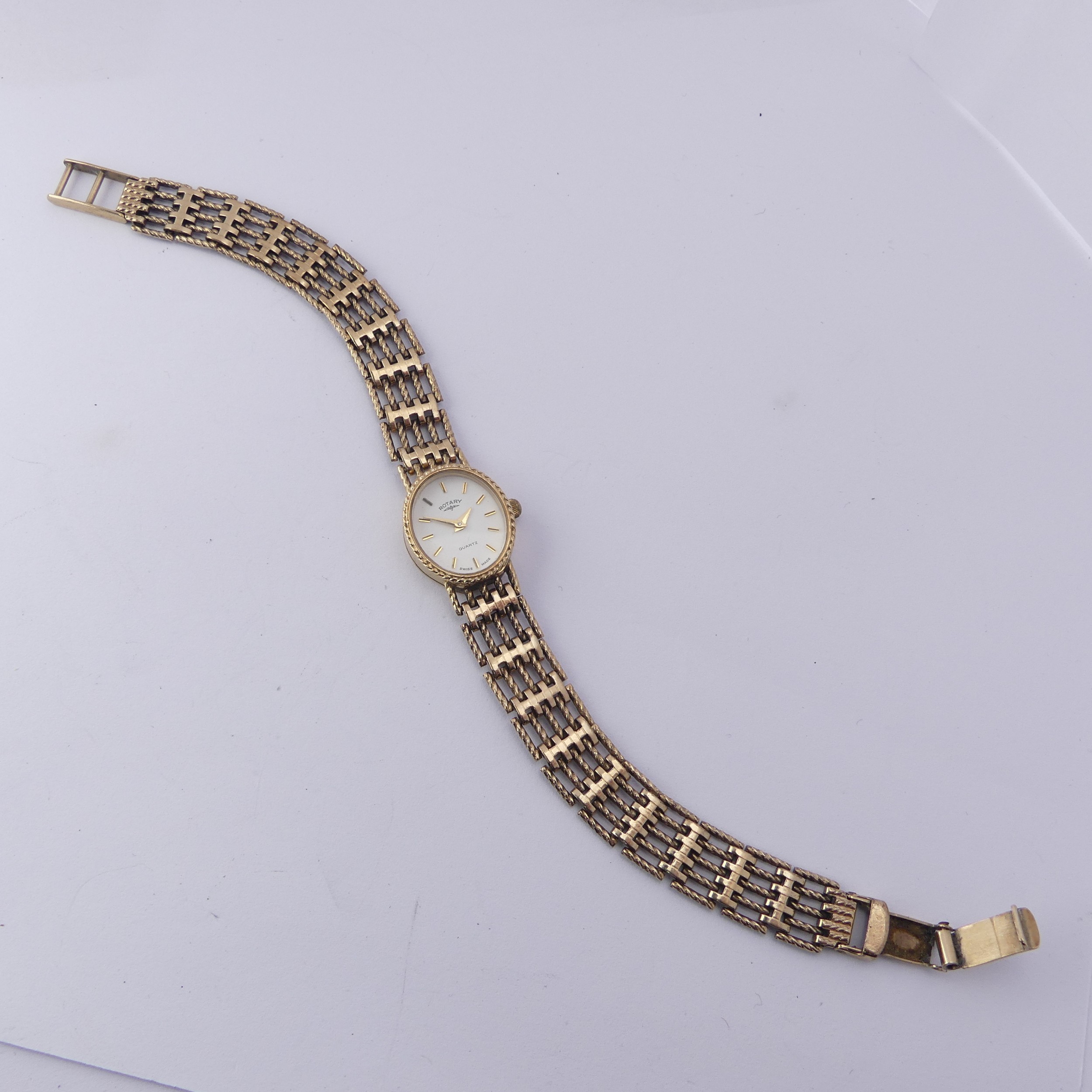 A 9ct gold lady's Rotary Wristwatch, with quartz movement, on a 9ct gold bracelet strap, gross total