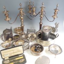 A pair of silver plated three light Candelabra, circular bases with knopped stems and scrolling