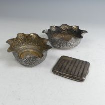 A pair of Indian silver Bowls, of oval form with wavy rims, with typical continuous scene decoration