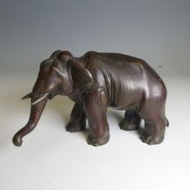 A Japanese bronze model of an Elephant, modelled standing with its trunk slightly raised, bronze