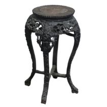 A Chinese carved hardwood and pink marble circular Plant Stand, circa 1900, probably Padouk Wood,