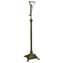 A large floor standing telescopic brass Lamp, raised on corinthian column and stepped base, H 153