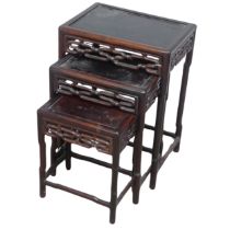 A Chinese nest of three hardwood Tables, probably huanghuali, circa 1900, rectangular tops above