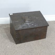 An Arts and Crafts copper coal Box in the manner of John Pearson, with embossed ship and rising