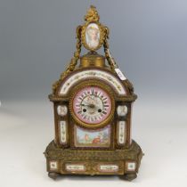 A late 19th century French gilt metal and Sevres style porcelain inset mantel Clock, in the Louis