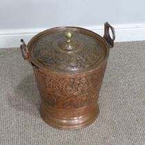 An Arts and Crafts hammered copper Bucket, embossed with Art Nouveau inspired stylised flowers and