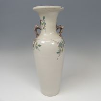 An unusual Chinese blanc de chine prunus Vase, the plain body with twin handles in the form of