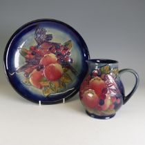 A Moorcroft 'Finches' pattern Jug, designed by Sally Tuffin, the tube-lined design on blue ground, H