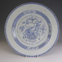 An 18thC Chinese porcelain pencil-style Charger, Yongzheng, decorated with ornate flower basket to