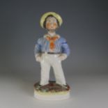 A 19thC Staffordshire pottery figure of a Sailor, decorated in polychromes, raised on gilt line