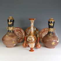 A pair of antique Japanese Satsuma Vases, of bottle form, with dark brown and black ground decorated