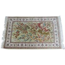 Tribal Rugs; a finely hand-knotted Persian pictorial rug, silk pile on silk base, pale green and