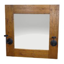 An impressive craftsman-made oak framed Wall Mirror, with iron candle sconces, 122cm x 122cm.