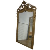 A large 19th century French style gilt framed wall Mirror, the crest with central carved acanthus